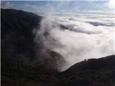 Mist swirls in the valleys