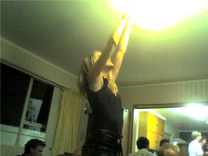 ana playing with the chandellier