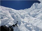 Me and Manoel descend to saddle from summit through ice gully