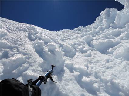 Me and Manoel descend to saddle from summit through ice gully