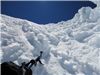 Me and Manoel descend to saddle from summit through ice gully